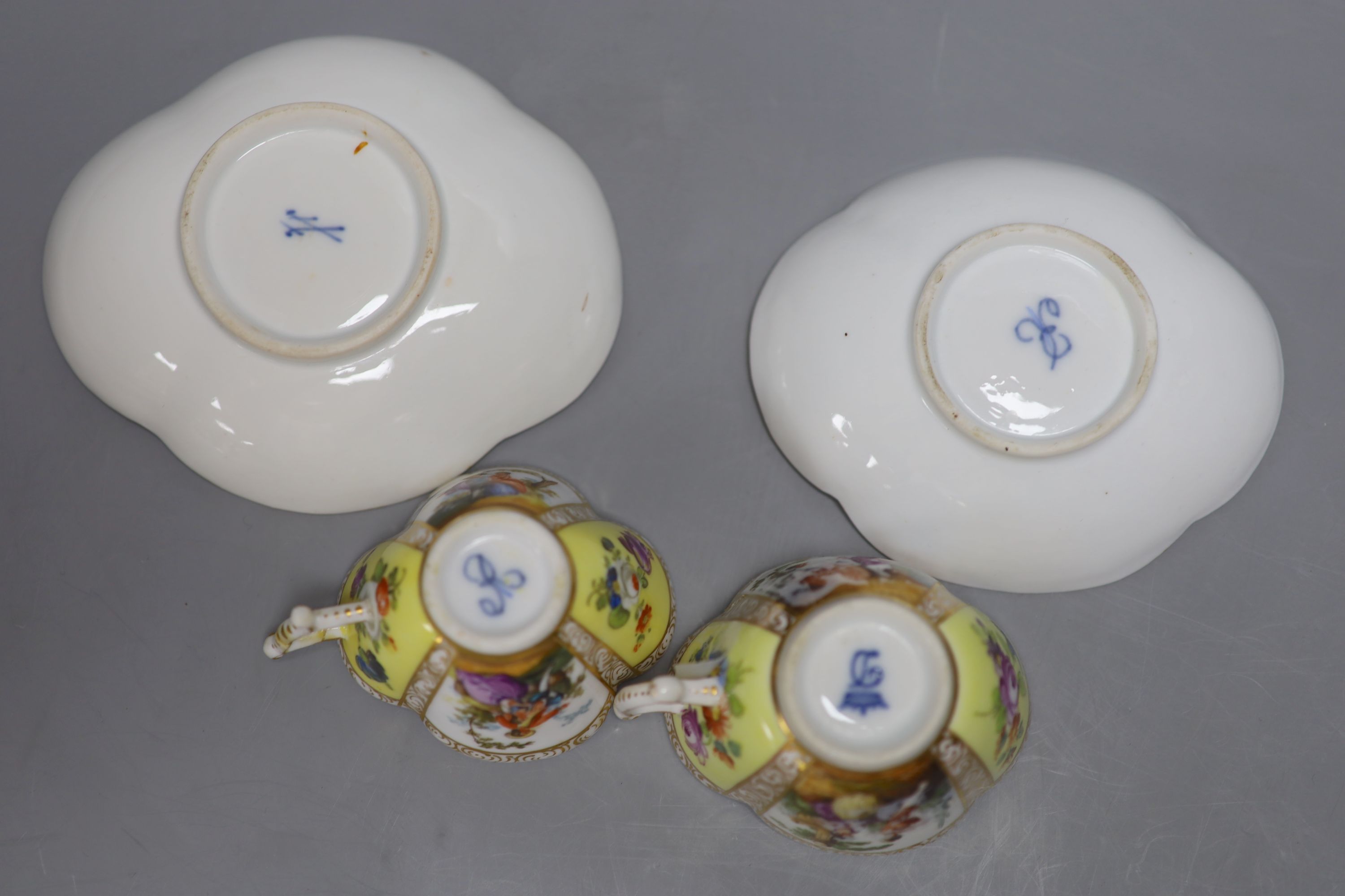 Two Dresden cups, one Dresden saucer and a Meissen saucer